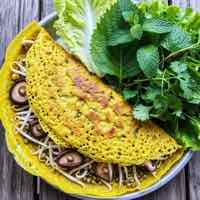Vietnamese vegan sizzling turmeric crepe with bean sprouts