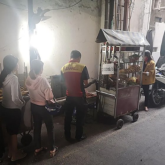 The banh mi cart and charcoal grill at 37 Nguyen Trai, Saigon